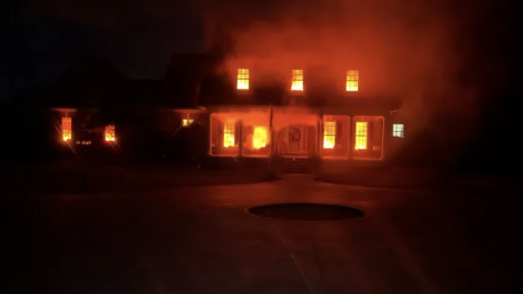 Sam Lee and Amanda Riggins Peden are known in Fountain Inn, South Carolina for their big Halloween decorations. This year, the couple's house appears to be engulfed in flames through an amazing illusion. Courtesy Sam Lee
