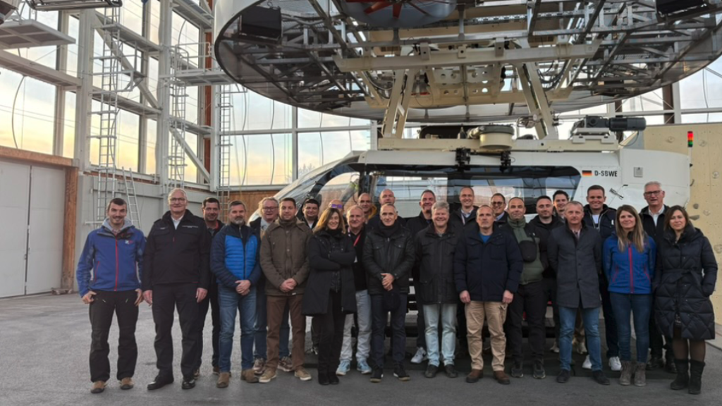 Figures 3a and b: The tour of the unique Bavarian Mountain Rescue Service's Center for Safety and Training, with its training and continuing education facilities featuring two different helicopter simulators and various indoor environments, generated considerable interest. (Photos: Dr. Cimolino, CTIF) Dr. Ulrich Cimolino Chairman of the Working Group W at the German Mountain Rescue Association (DFV) Member of the CTIF's FFC